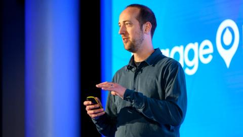 Speakers at an Acquia engage event presenting on stage